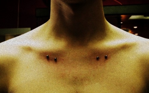 Man With Silver Barbells Clavicle Piercing