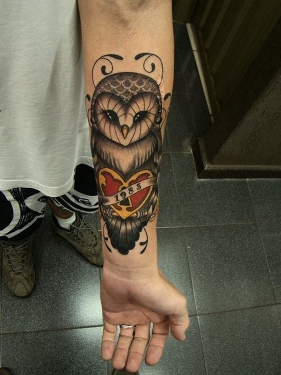 Memorial Owl With Heart Lock And Banner Tattoo On Left Forearm