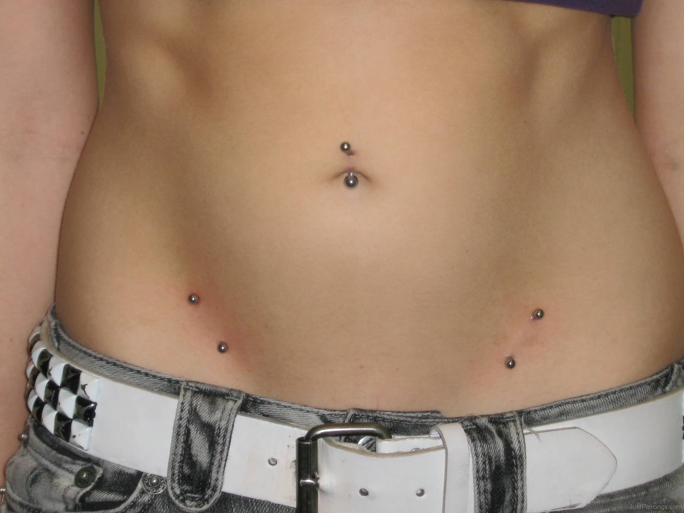 Navel Piercing And Hip Piercings With Silver Barbells