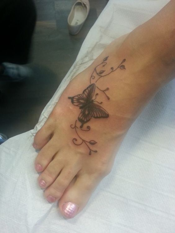 Nice Black And Grey Ink Butterfly Foot Tattoo