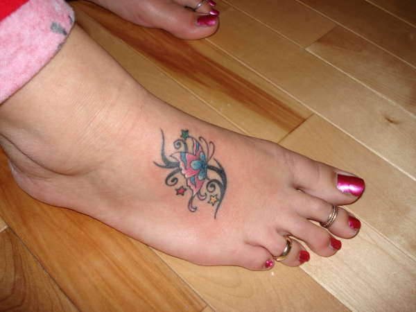 Nice Black Tribal Butterfly Foot Tattoo