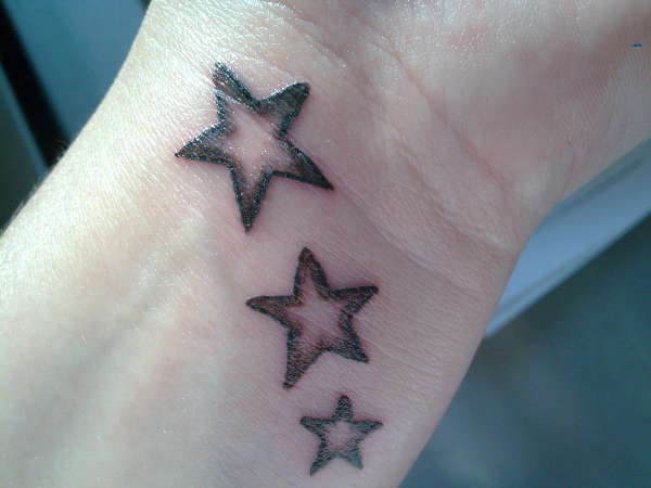 Nice Three Grey Star Tattoo On Left Wrist