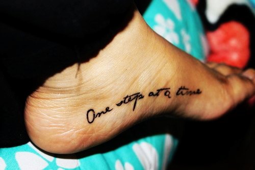 One Step At A Time Quote Tattoo on Foot