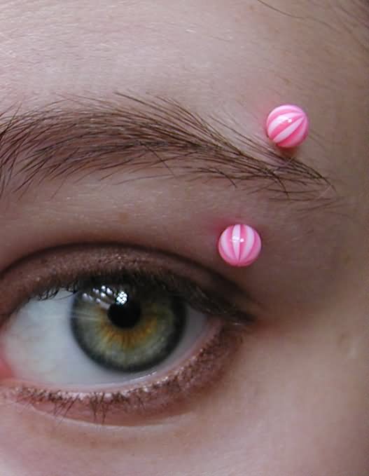 Pink Barbell Eyebrow Piercing
