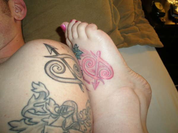 Pink Ink Sagittarius Zodiac Sign Tattoo On Right Foot