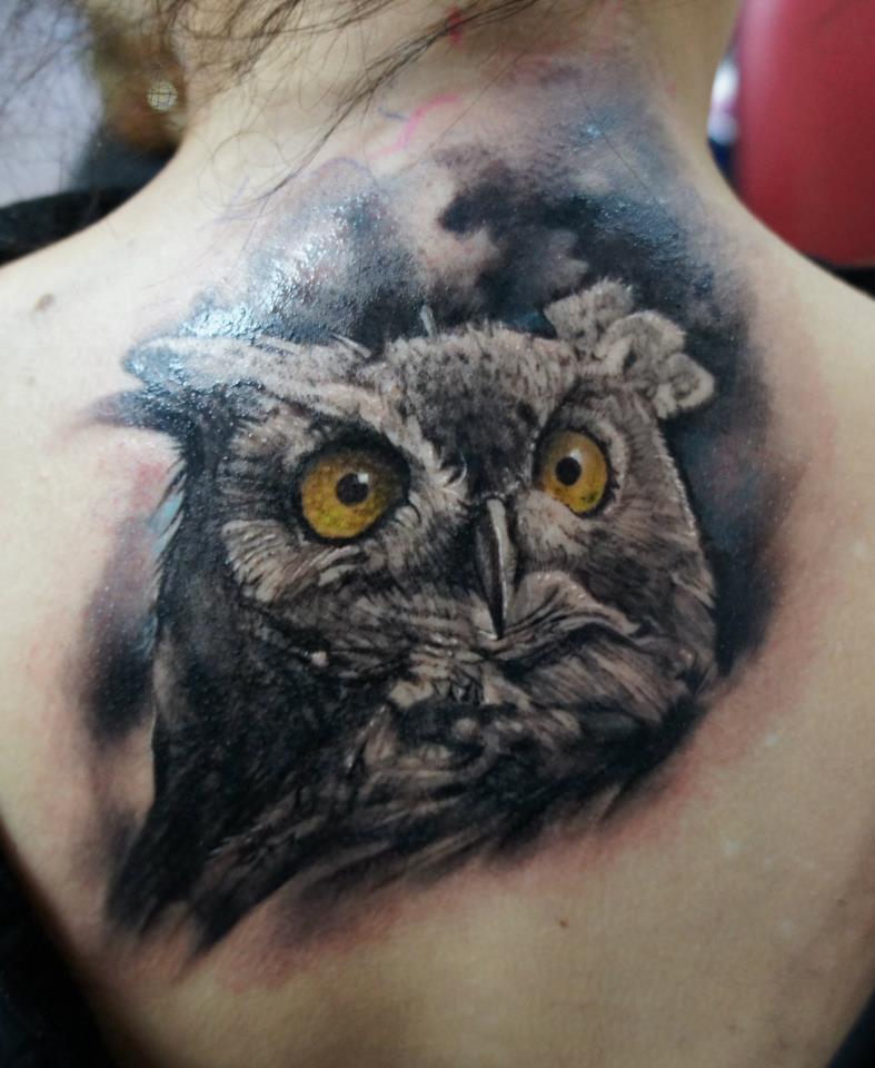 Realistic Owl Head Tattoo On Upper Back By Domantas Parvainis