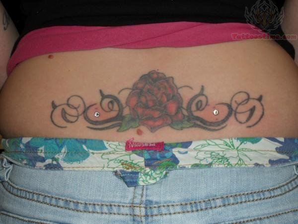 Red Flower Tattoo And Back Dimple Piercing