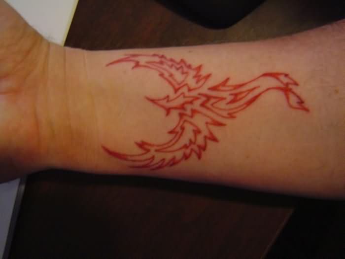 Red Outline Tribal Phoenix Tattoo On Forearm