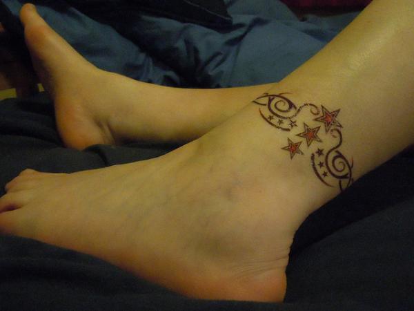 Red Stars And Tribal Ankle Band Tattoo