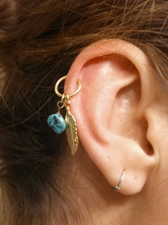 Right Ear Lobe And Helix Piercings With Feather Ring