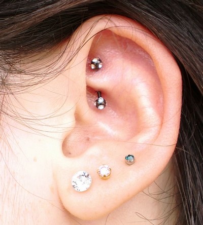 Rook Piercing With Black And White Barbell