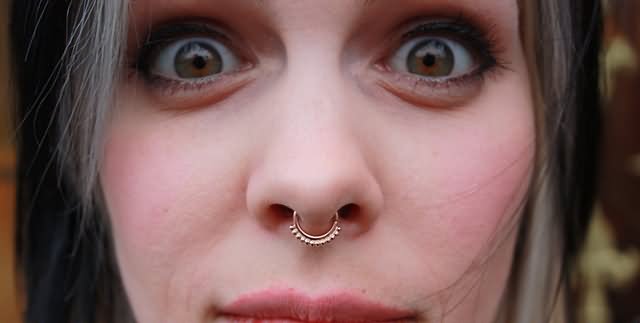 Septum Piercing With Gold Jewelry Ring