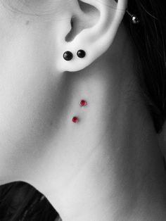Side Neck Piercing With Red Dermal Anchors