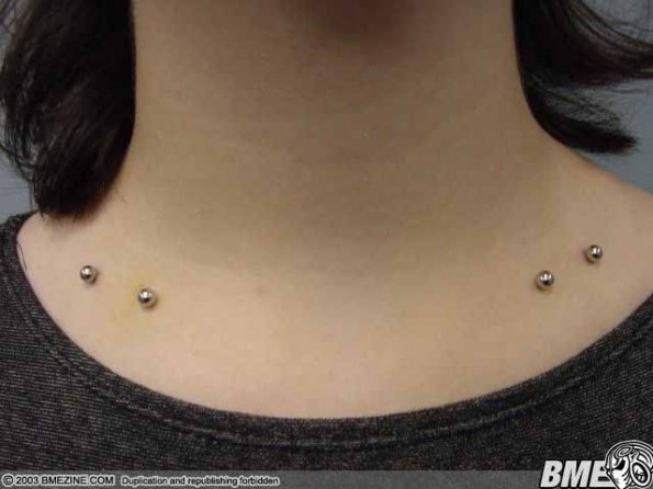 Silver Barbells Clavicle Piercing Image