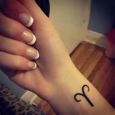 Simple Black Aries Zodiac Sign Tattoo On Girl Right Wrist