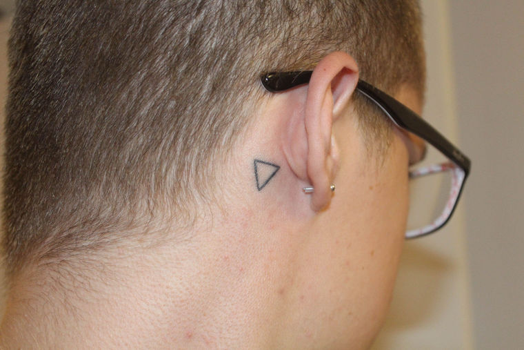 Simple Black Outline Upside Down Triangle Tattoo On Right Behind The Ear
