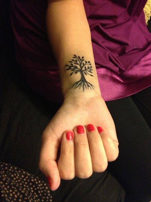 Simple Black Tree Of Life Tattoo On Girl Right Wrist