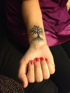 Small Black Tree Of Life Tattoo On Girl Right Wrist