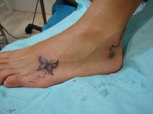 Small Grey Butterfly Left Foot Tattoo