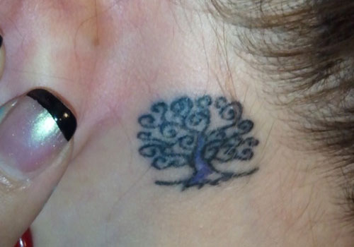 Small Tree Of Life Tattoo On Girl Left Behind The Ear