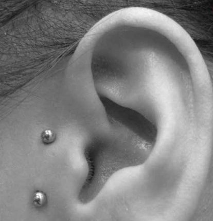 Surface Barbell Tragus Piercing