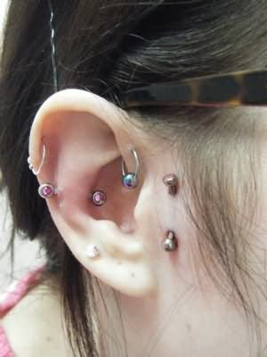 Surface Tragus And Snug Piercing