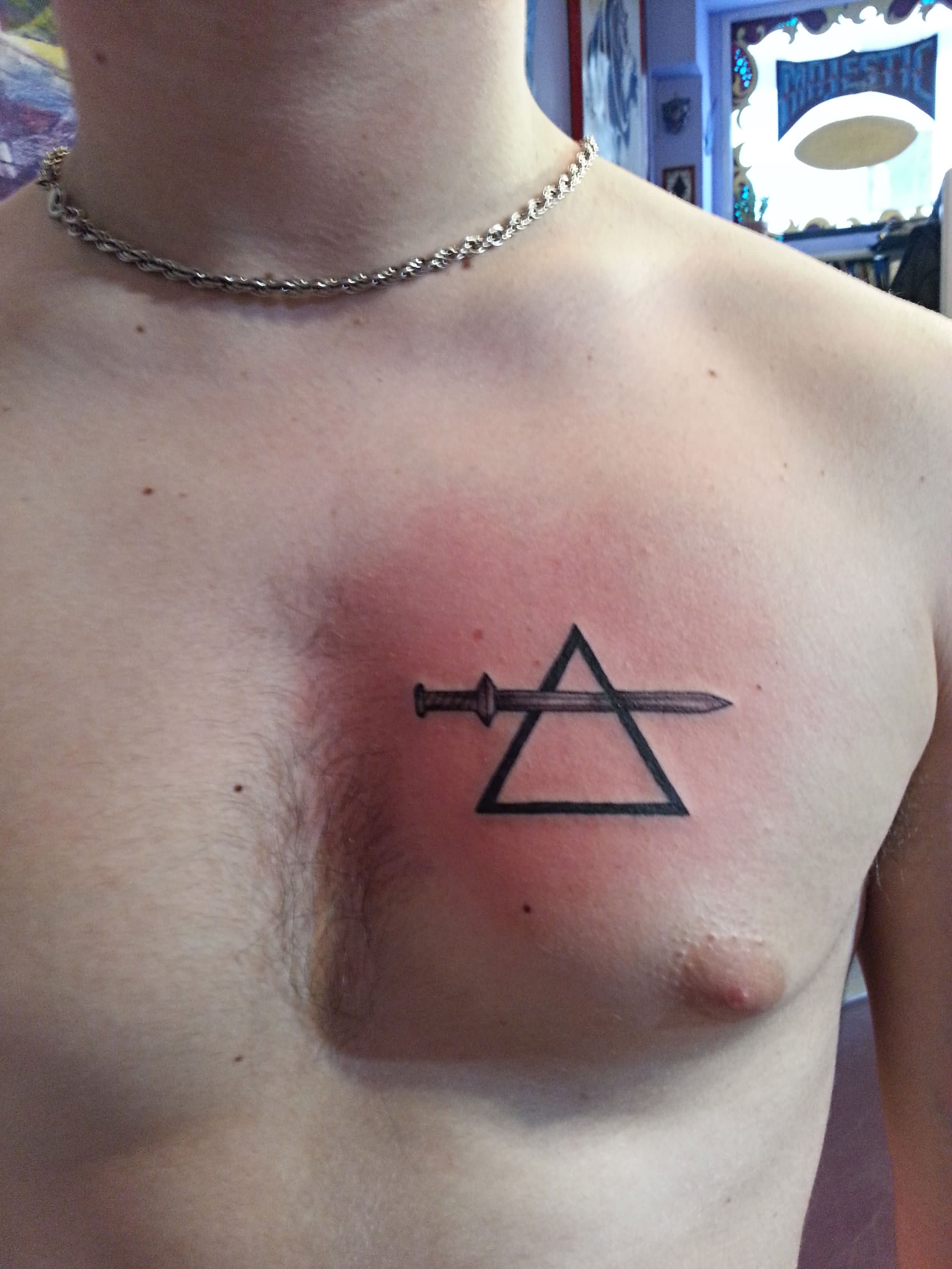 Sword In Triangle Tattoo On Man Right Chest