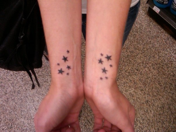 Tiny Black Wrist Star Tattoos