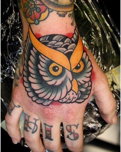 Traditional Owl Face Tattoo On Right Hand