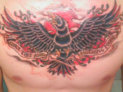 Traditional Phoenix With Banner Tattoo On Man Chest