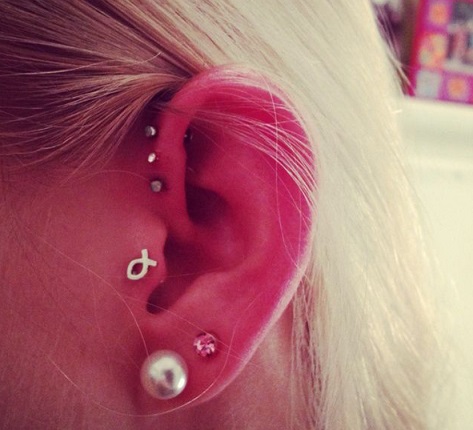 Tragus Piercing On Left Ear With Jesus Fish Stud