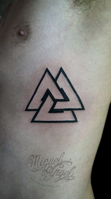 Unique Black Triangle Tattoo On Man Left Chest By Miguel Angel