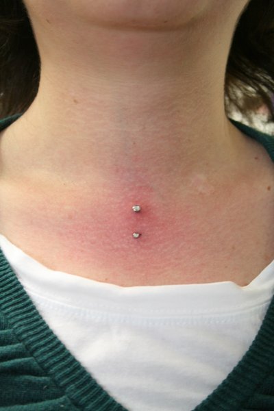 Vertical Front Neck Piercing With Barbell