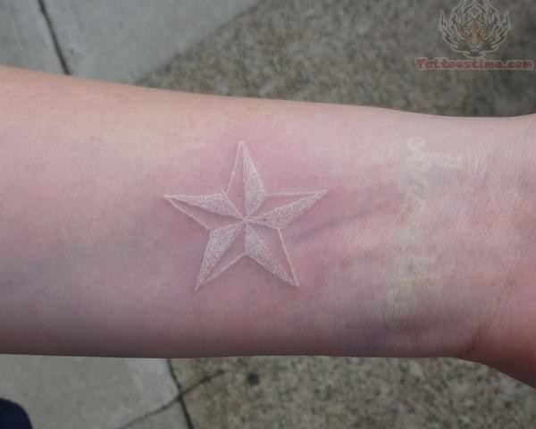 White Ink Nautical Star Wrist Tattoo
