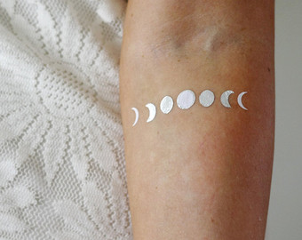 White Ink Phases Of The Moon Tattoo On Right Forearm