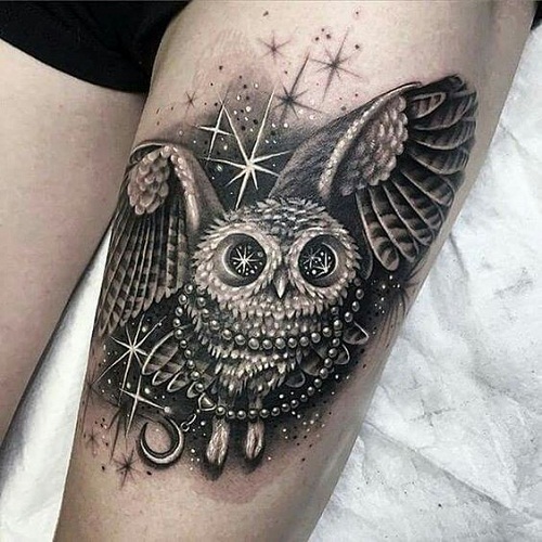 Wonderful Black And Grey Flying Owl Tattoo Design For Thigh
