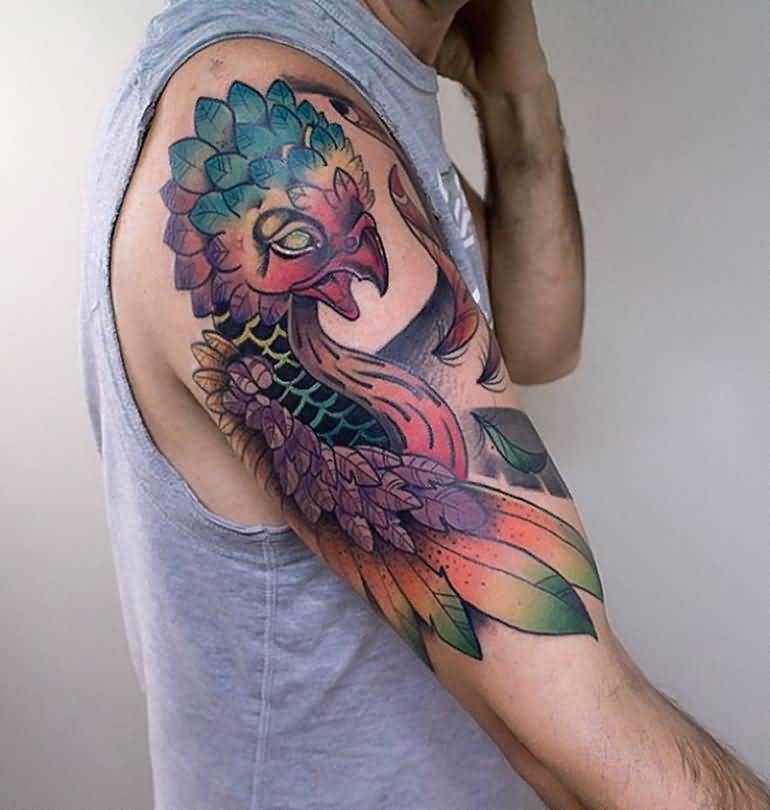 Wonderful Colorful Flying Phoenix Tattoo On Man Right Upper Arm