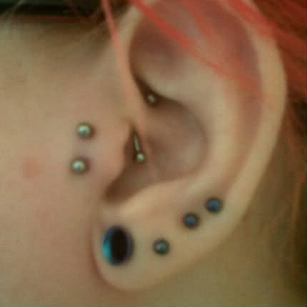 Amazing Ear Lobe And Rook Piercing With Tragus Piercing