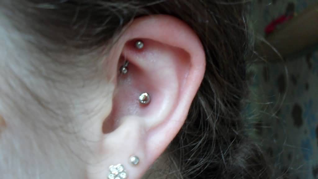 Amazing left Ear Lobe And Rook Piercing Idea For Girls