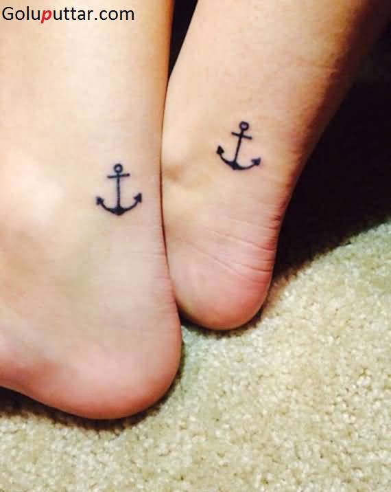 Awesome Black Anchor Tattoo On Couple Ankle
