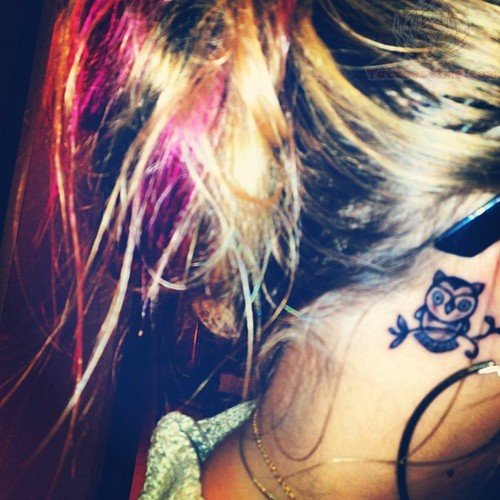 Awesome Black Ink Owl Tattoo On Girl Right Behind The Ear
