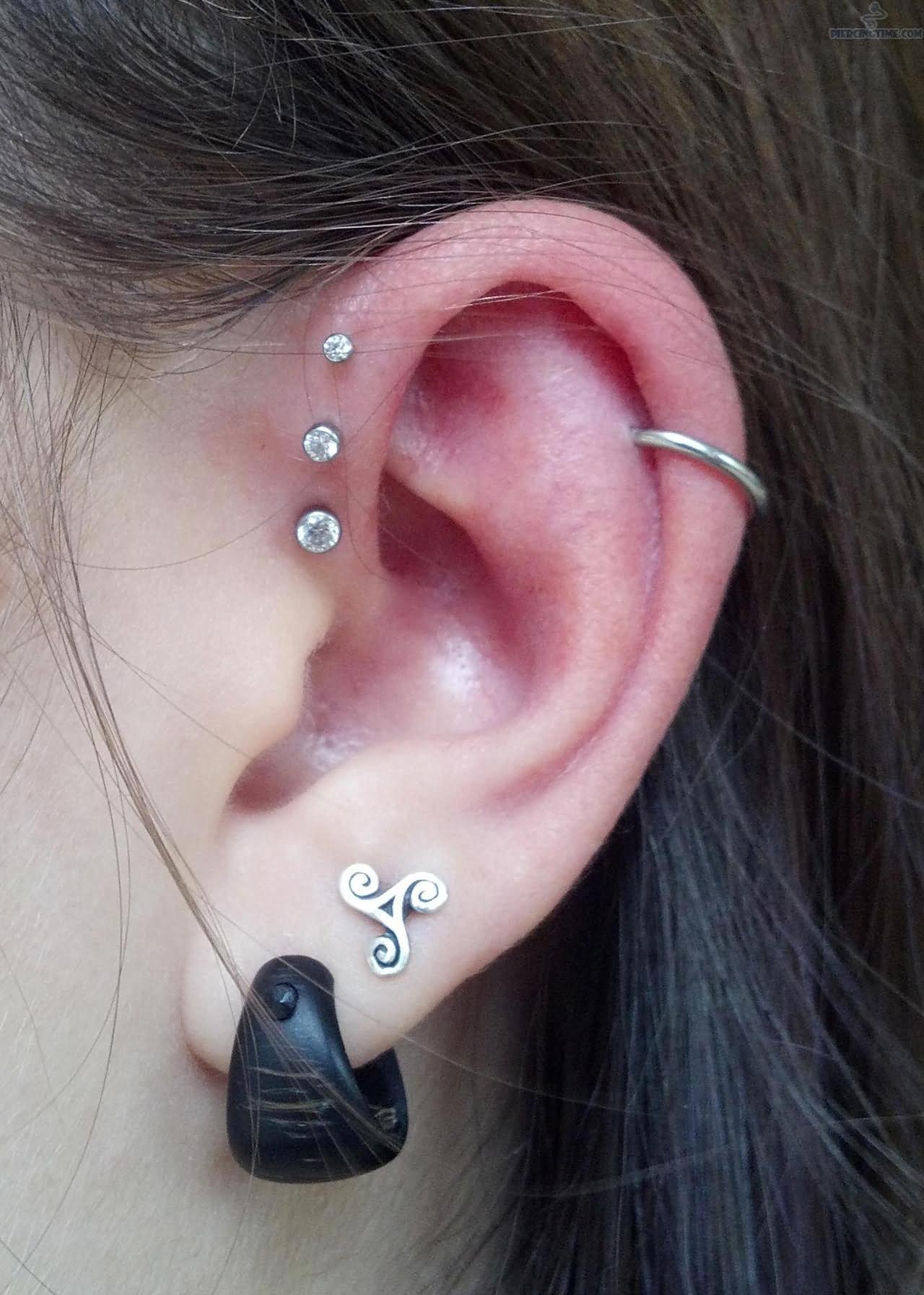 Awesome Double Lobes And Triple Inner Pinna Piercing For Young Girls