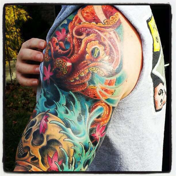 Awesome Japanese Octopus With Skull Tattoo On Left Half Sleeve