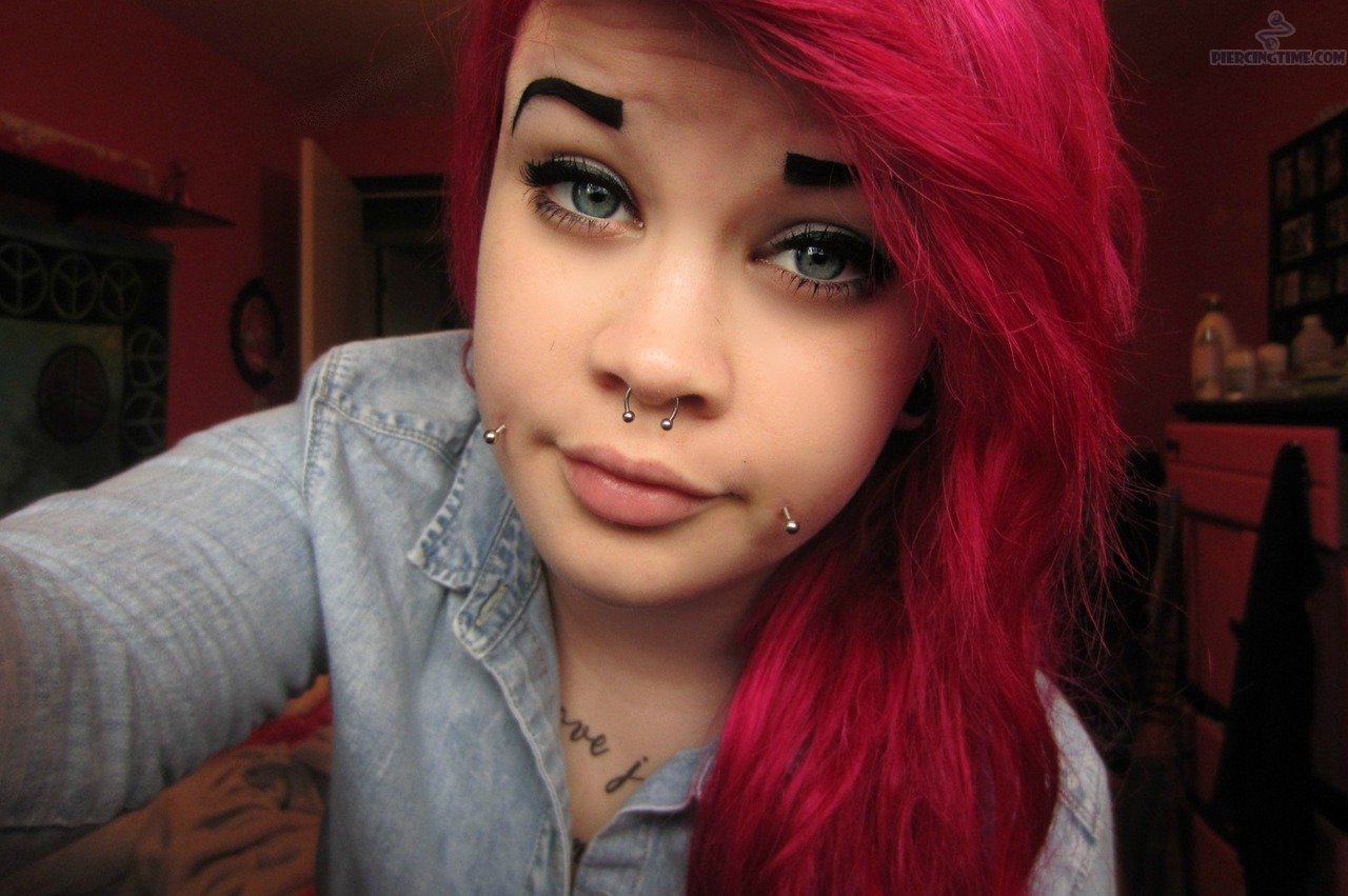 Awesome Septum And Cheek Piercing Picture