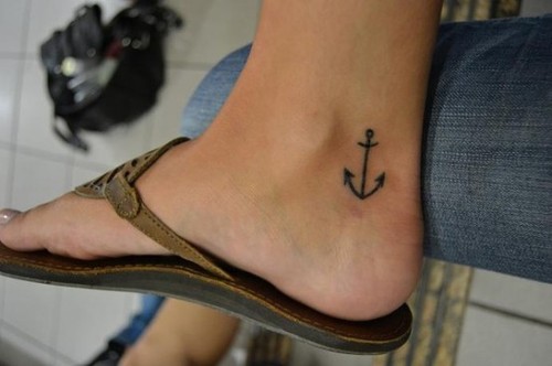 Awesome Simple Black Anchor Tattoo On Girl Right Heel