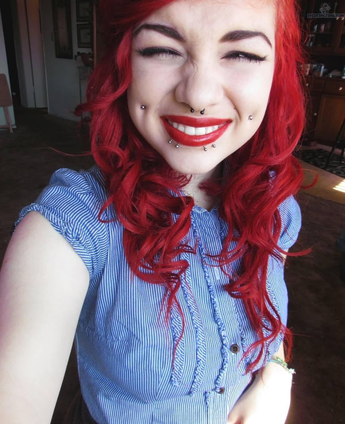 Beautiful Smiling Girl With Cheek Piercings
