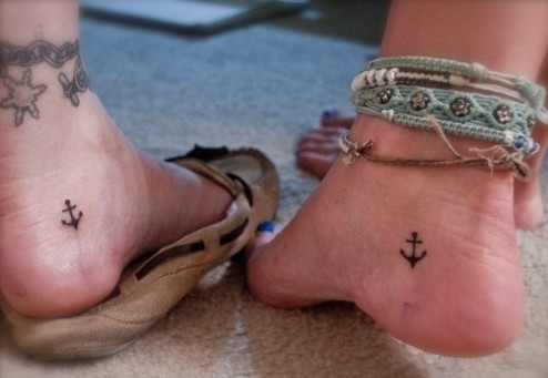 Black Anchor Tattoo On Couple Ankle