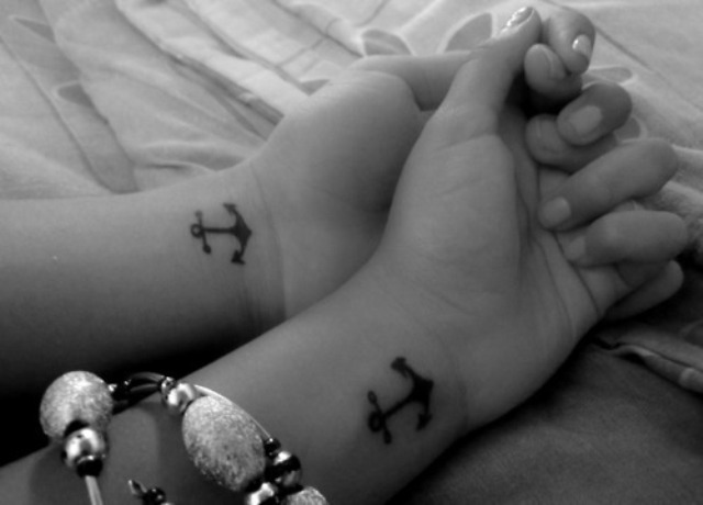 Black Anchor Tattoo On Couple Left Wrist