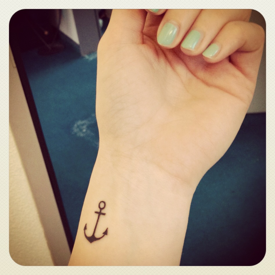 Black Anchor Tattoo On Girl Left Wrist