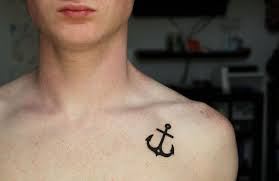 Black Anchor Tattoo On Man Left Front Shoulder